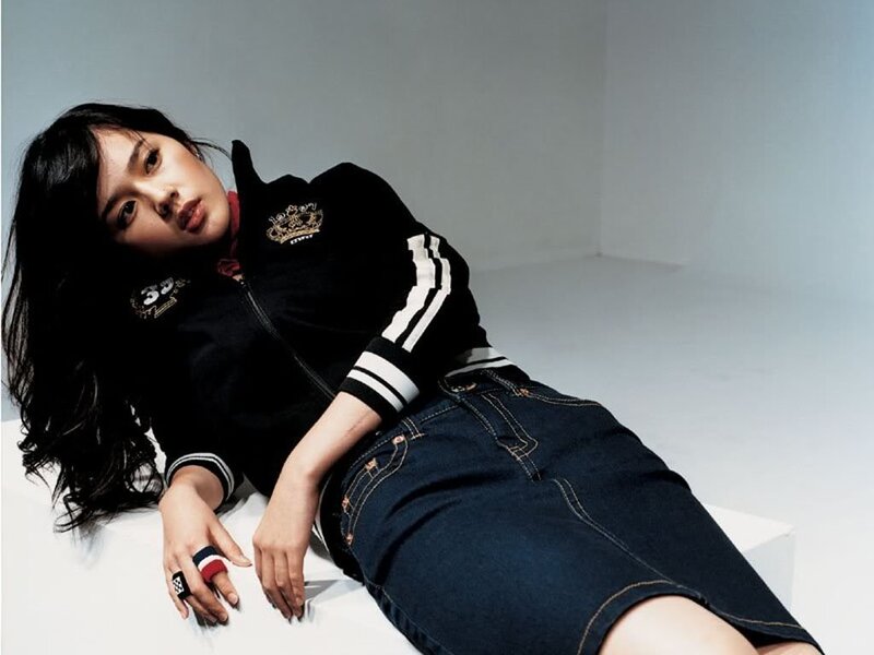 woman in black jacket and jeans