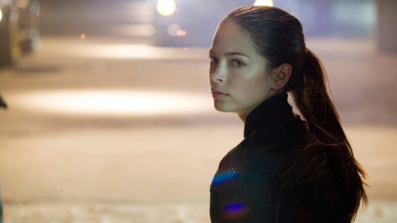 woman in black jacket at night