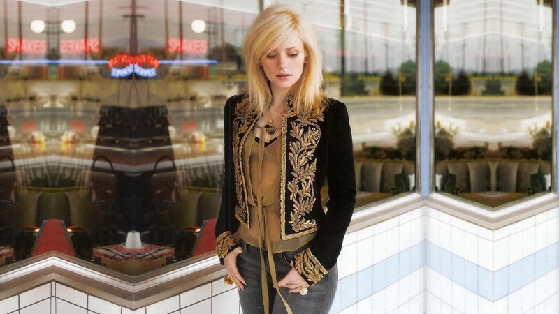 Woman in Black Jacket — Contemplative, Photograph, Neon Sign, Window
