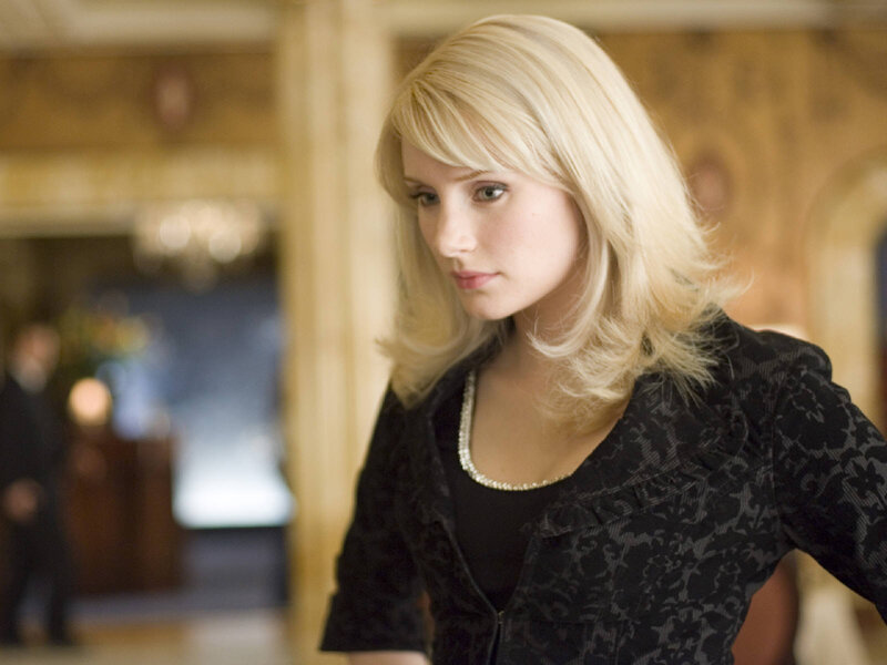 woman in black jacket looking down