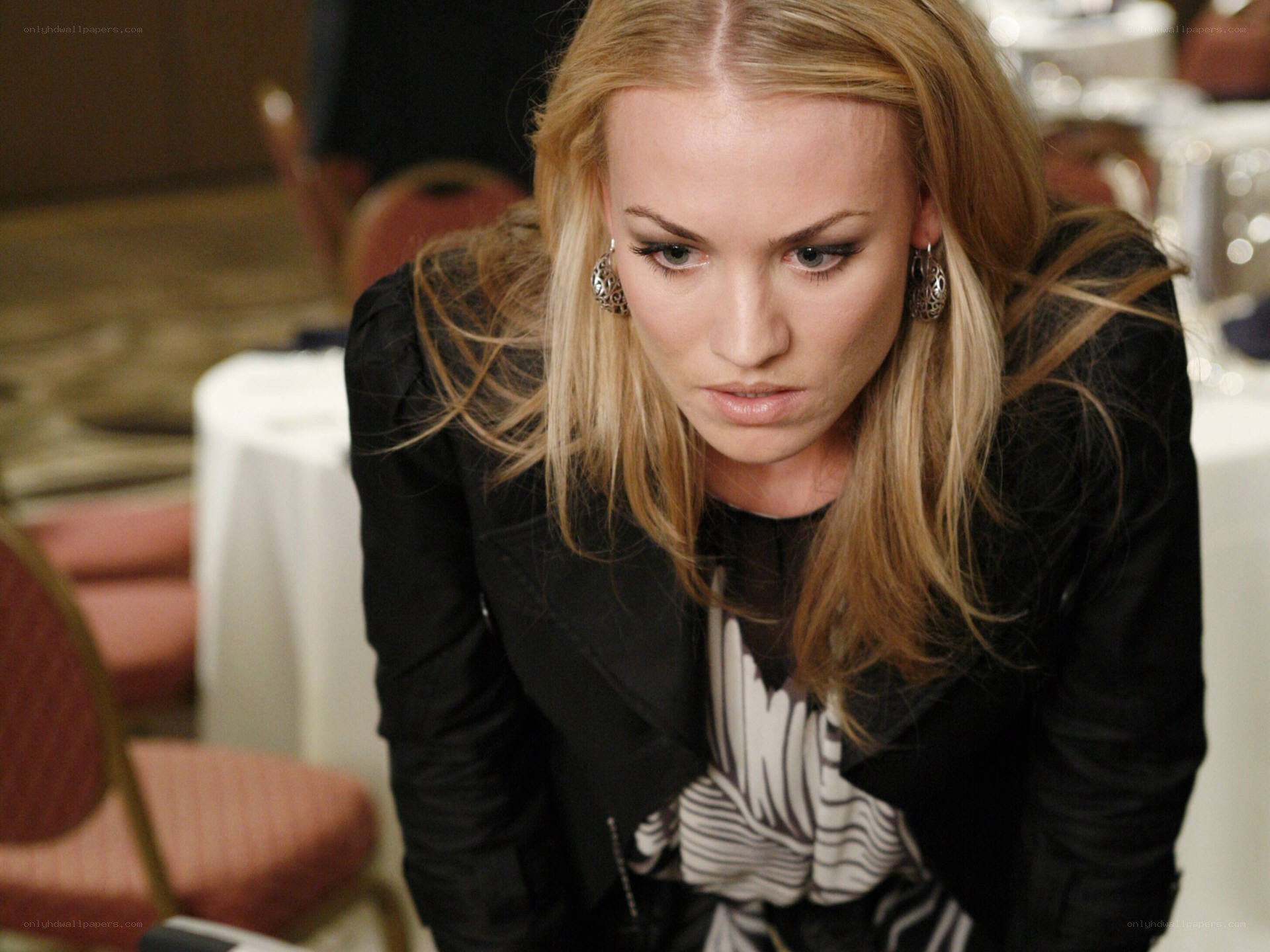woman in black jacket looking down