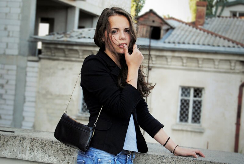 woman in black jacket on balcony