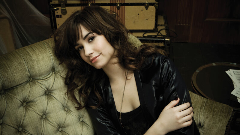 woman in black jacket on couch