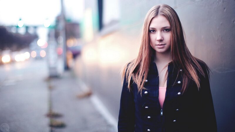 woman in black jacket on street