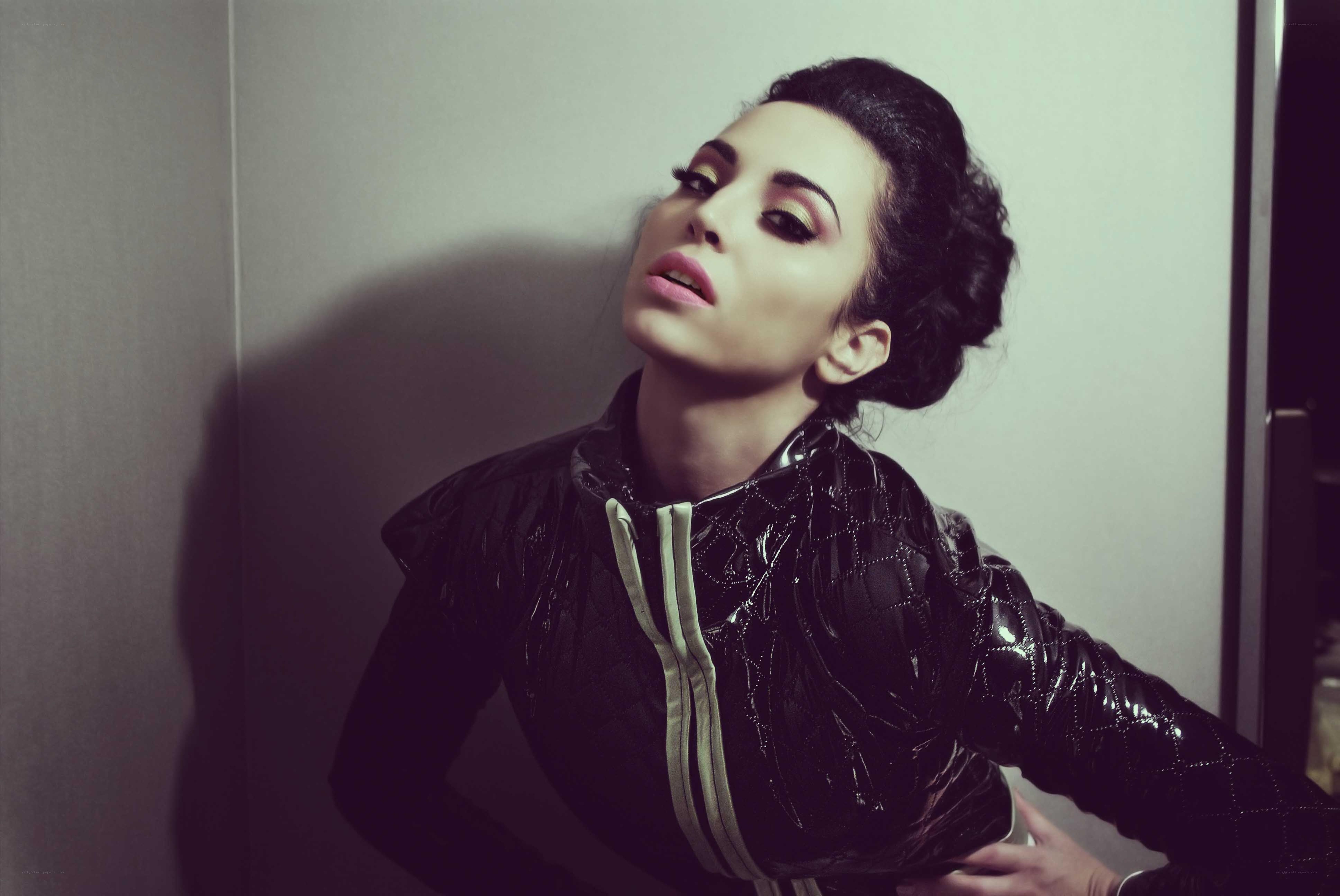 woman in black jacket posing