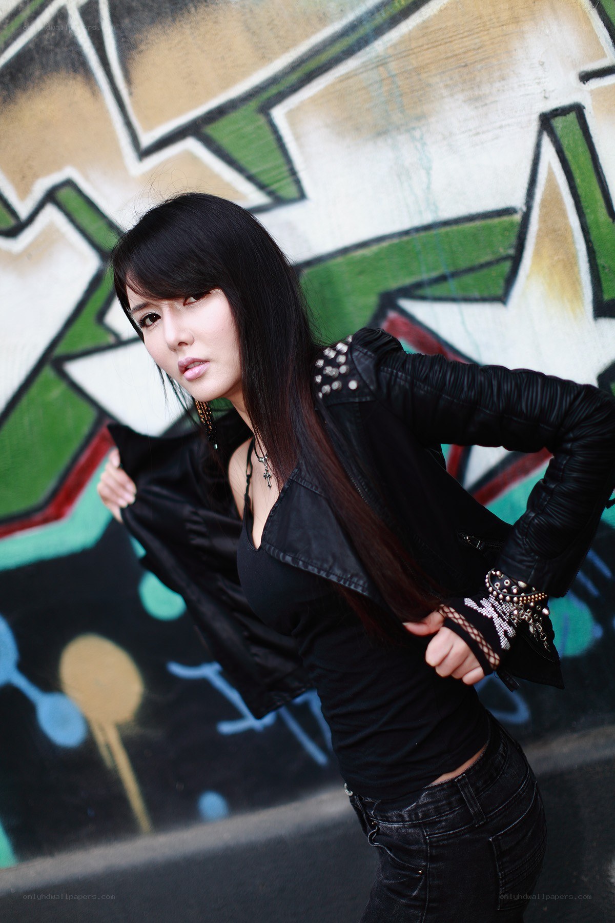 woman in black jacket posing