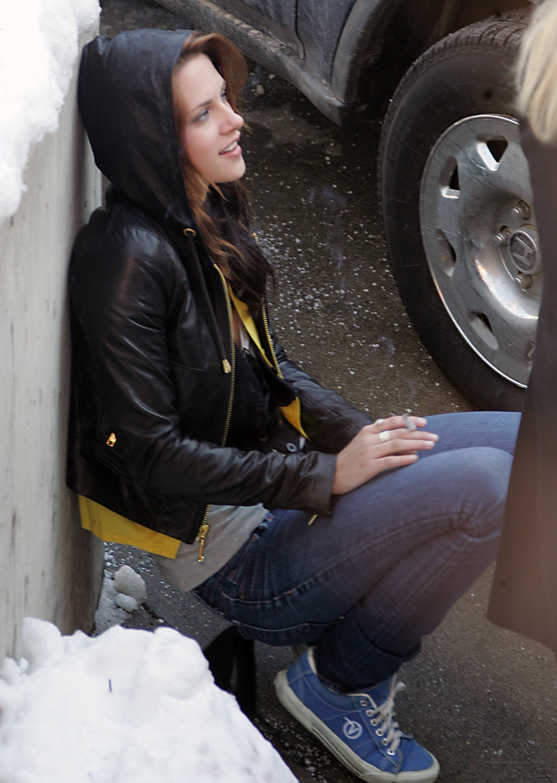woman in black jacket sitting outside
