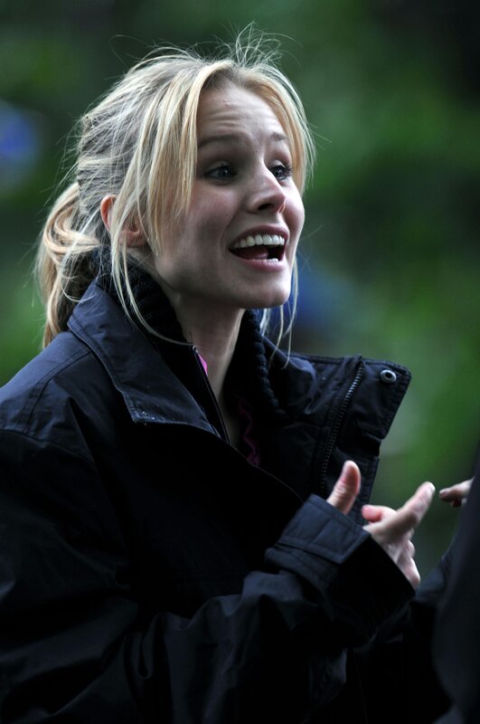 woman in black jacket smiling