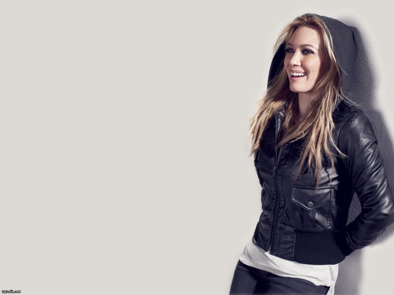 woman in black jacket smiling