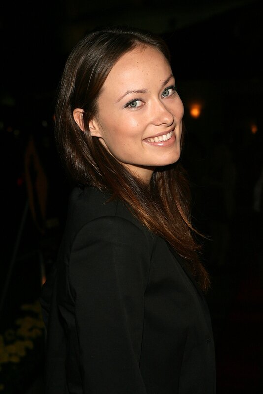 woman in black jacket smiling