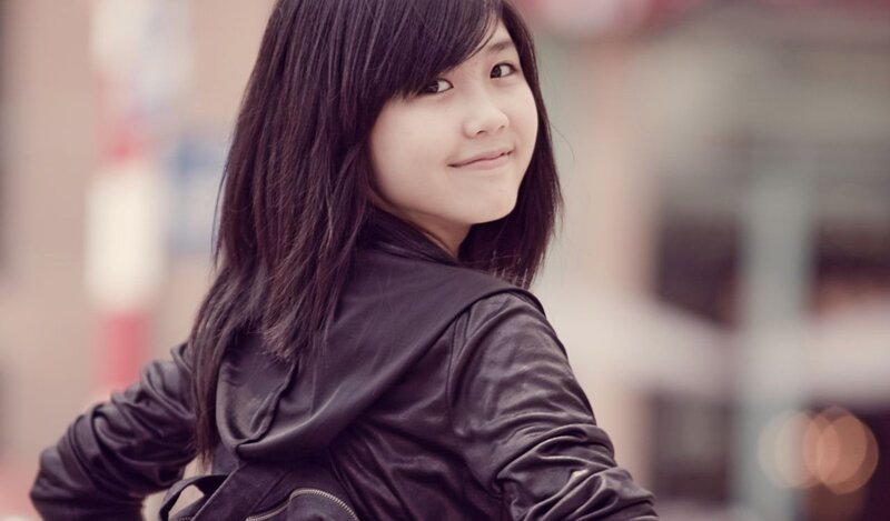 woman in black jacket smiling