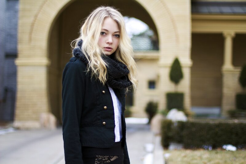 woman in black jacket standing outside