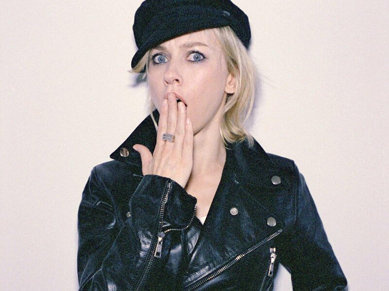 Woman in Black Jacket — Surprised