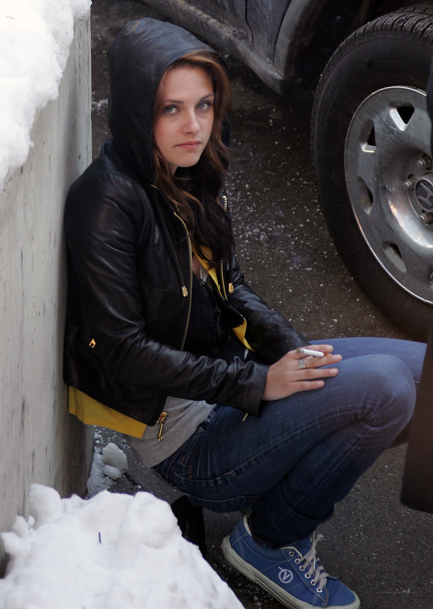 woman in black jacket with cigarette