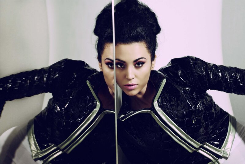 woman in black jacket with mirror
