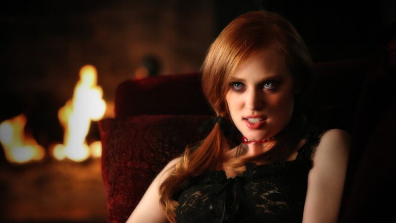 woman in black lace by fire