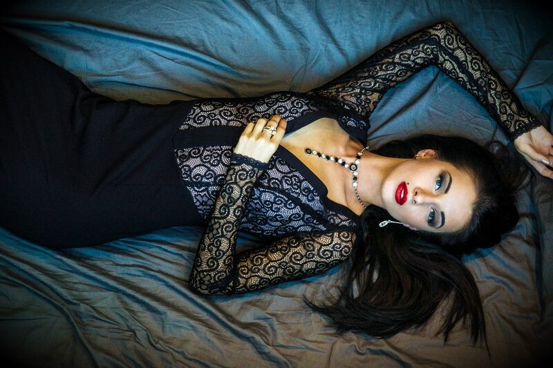 Woman in Black Lace Dress — Dramatic, Photograph, Bed