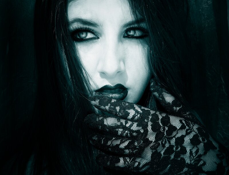 woman in black lace gloves