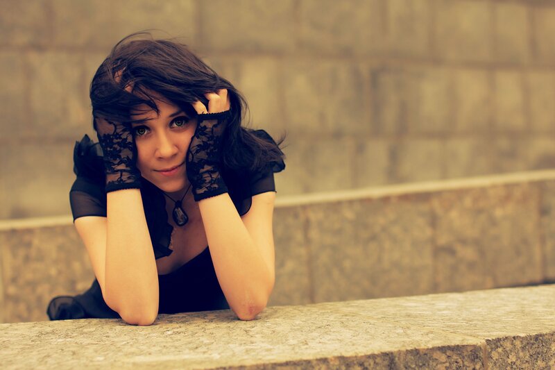 woman in black lace gloves