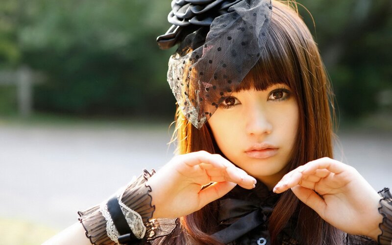 woman in black lace headpiece