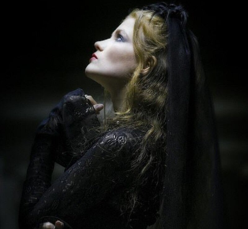 woman in black lace looking up
