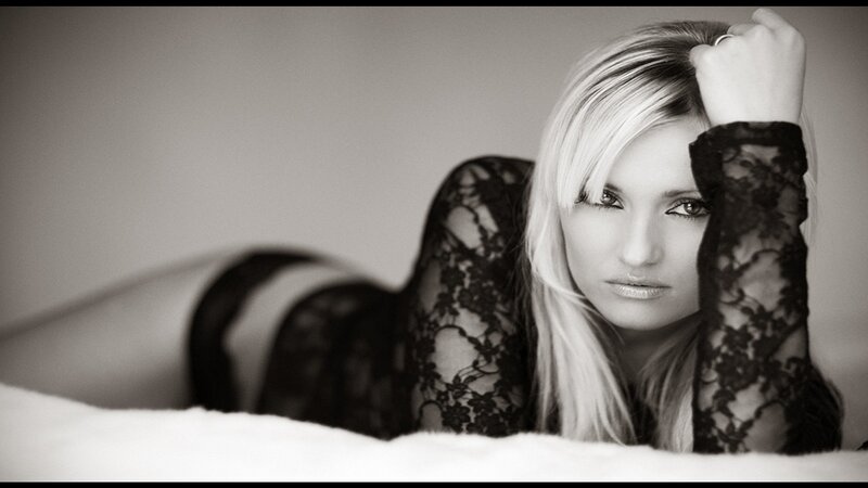 woman in black lace lying down
