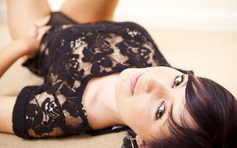 woman in black lace lying down