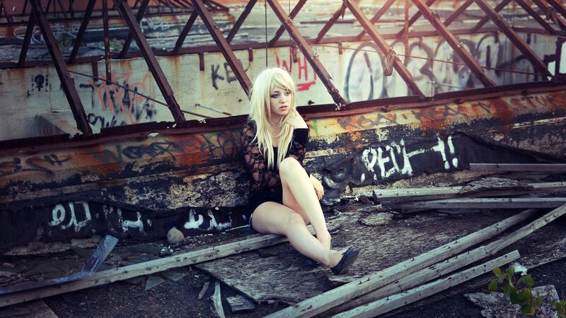 Woman in black lace on a derelict structure
