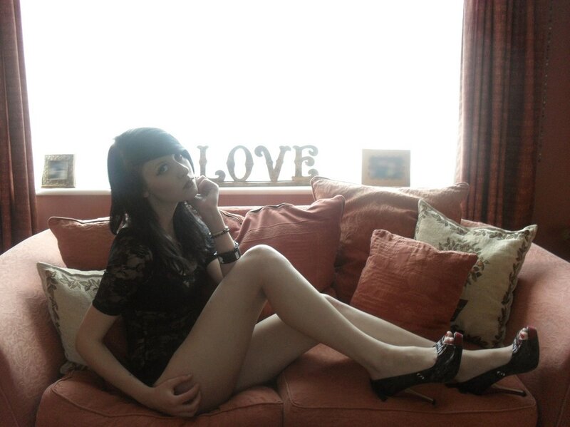 woman in black lace on sofa