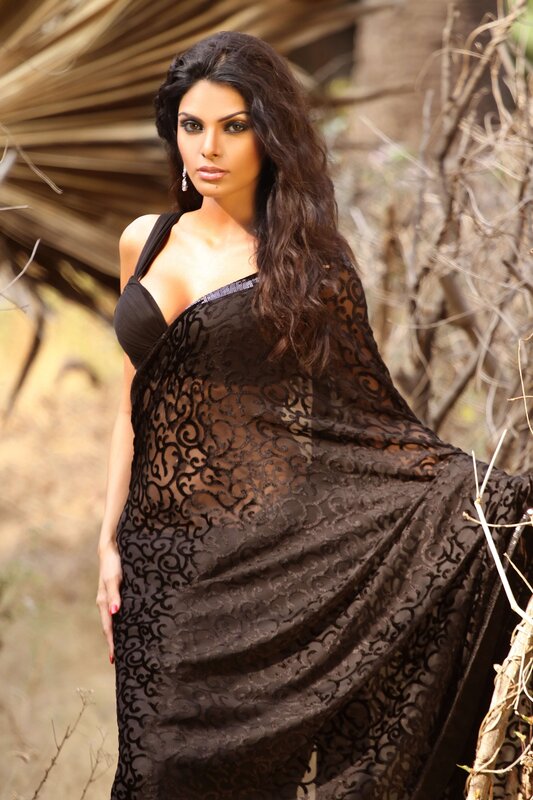 Woman in black lace saree
