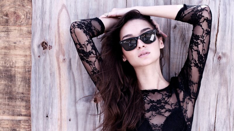 woman in black lace with sunglasses