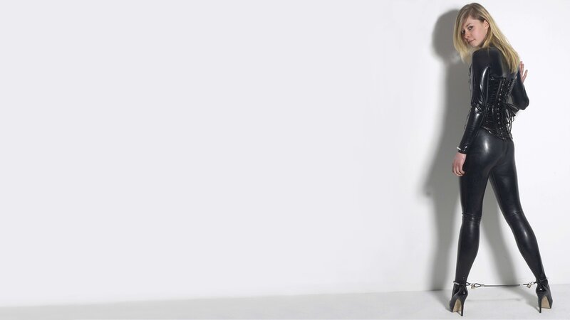 Woman in Black Latex Suit — Dramatic, Photograph, White Wall