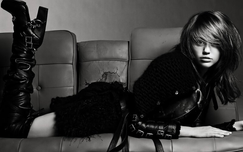 woman in black leather on couch