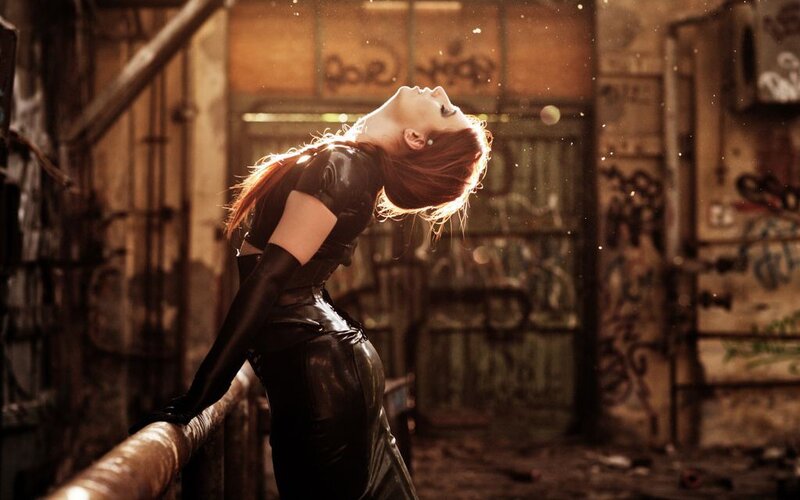 woman in black leather outfit