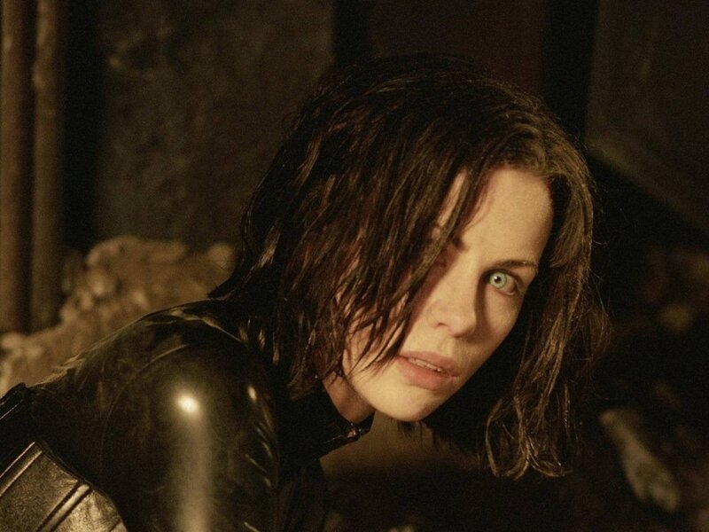 Woman in black leather suit