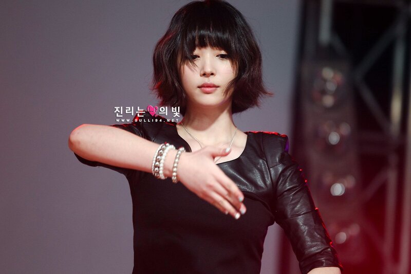 woman in black leather top