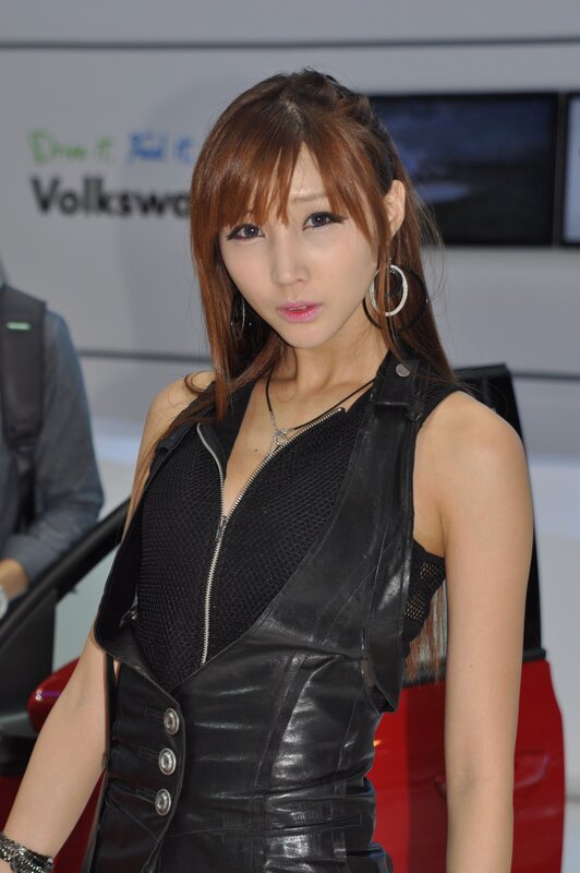 woman in black leather vest