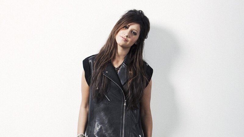 woman in black leather vest