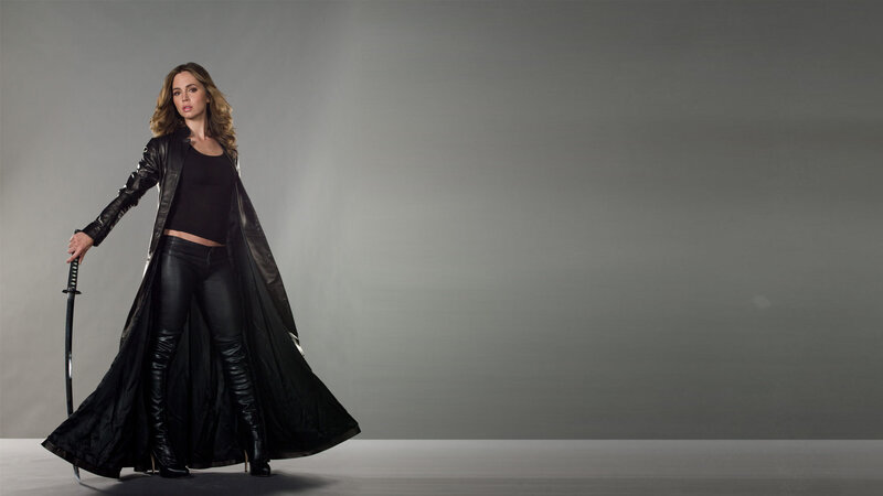 woman in black leather with sword