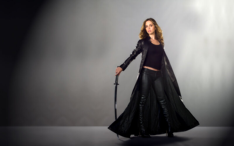 woman in black leather with sword