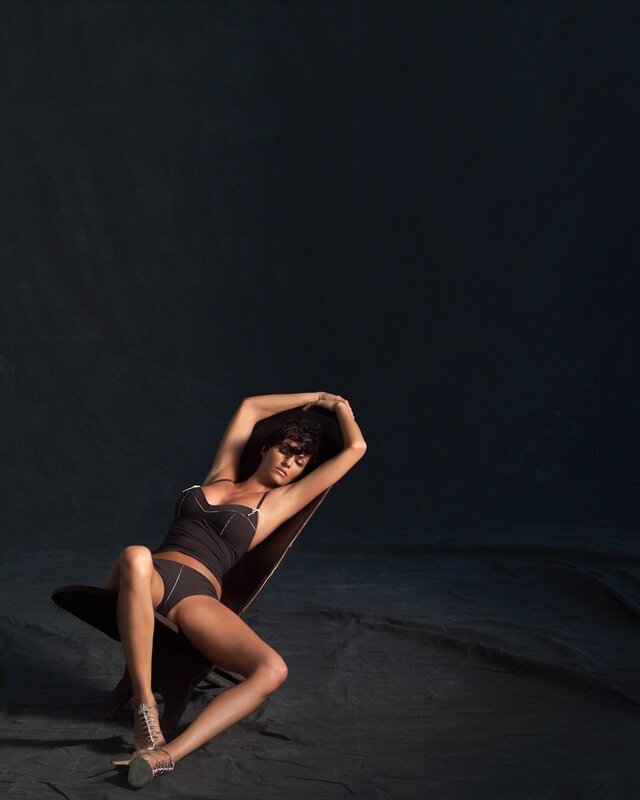 woman in black lingerie on chair