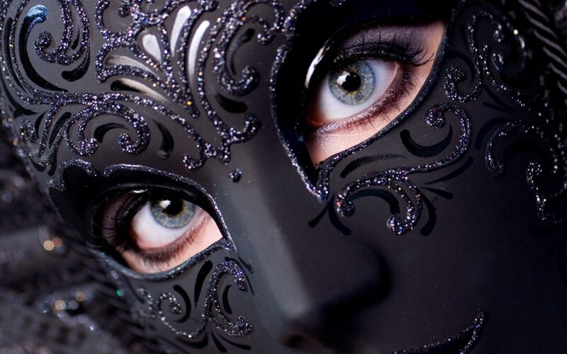 woman in black mask with glitter