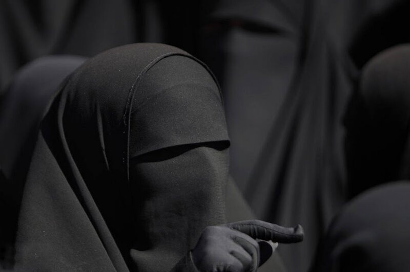 Woman in Black Niqab — Somber