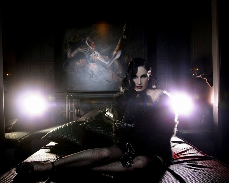 woman in black on a bed