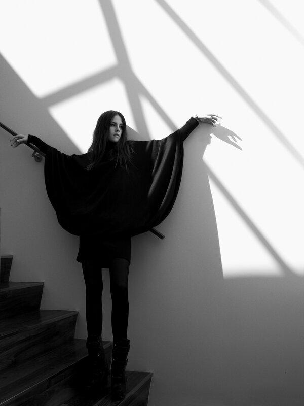 woman in black on stairs