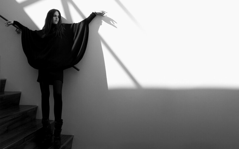 woman in black on stairs