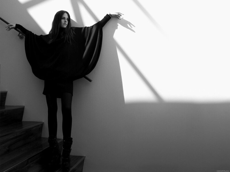 woman in black on stairs