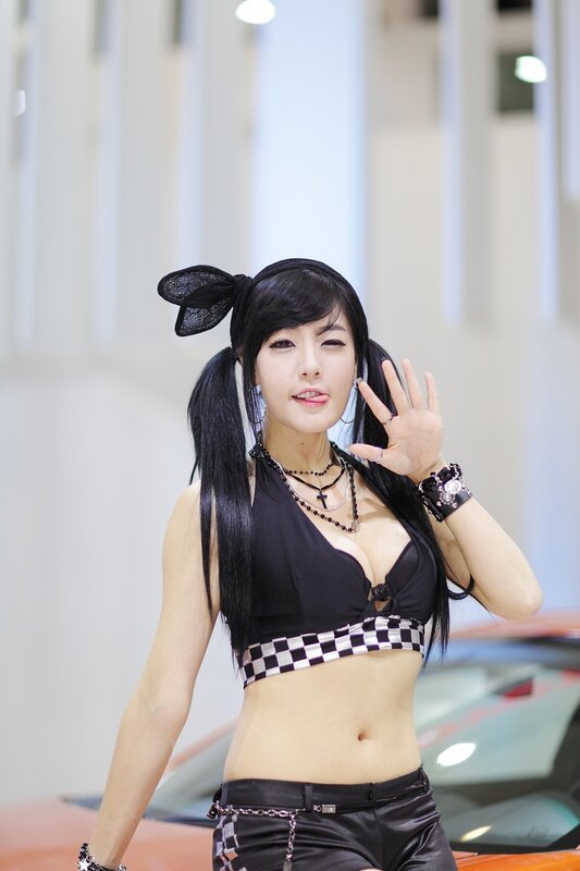 woman in black outfit at car show