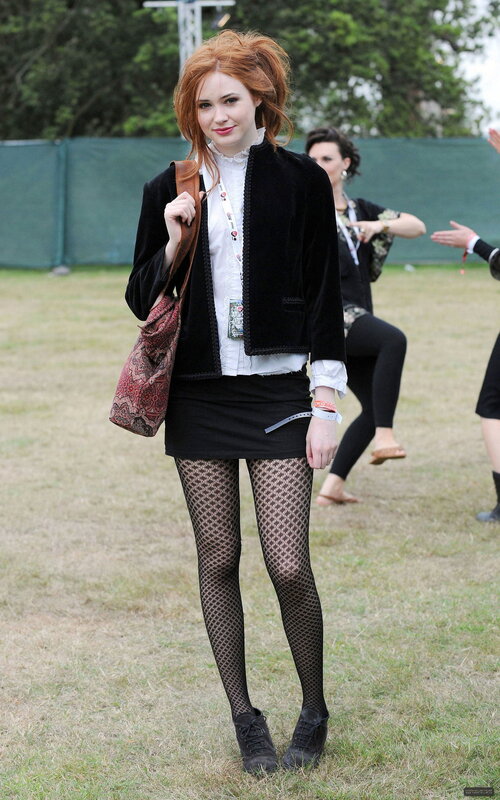 Woman in black outfit at festival