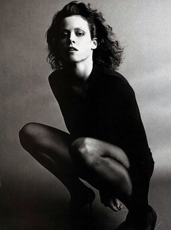 woman in black outfit crouching